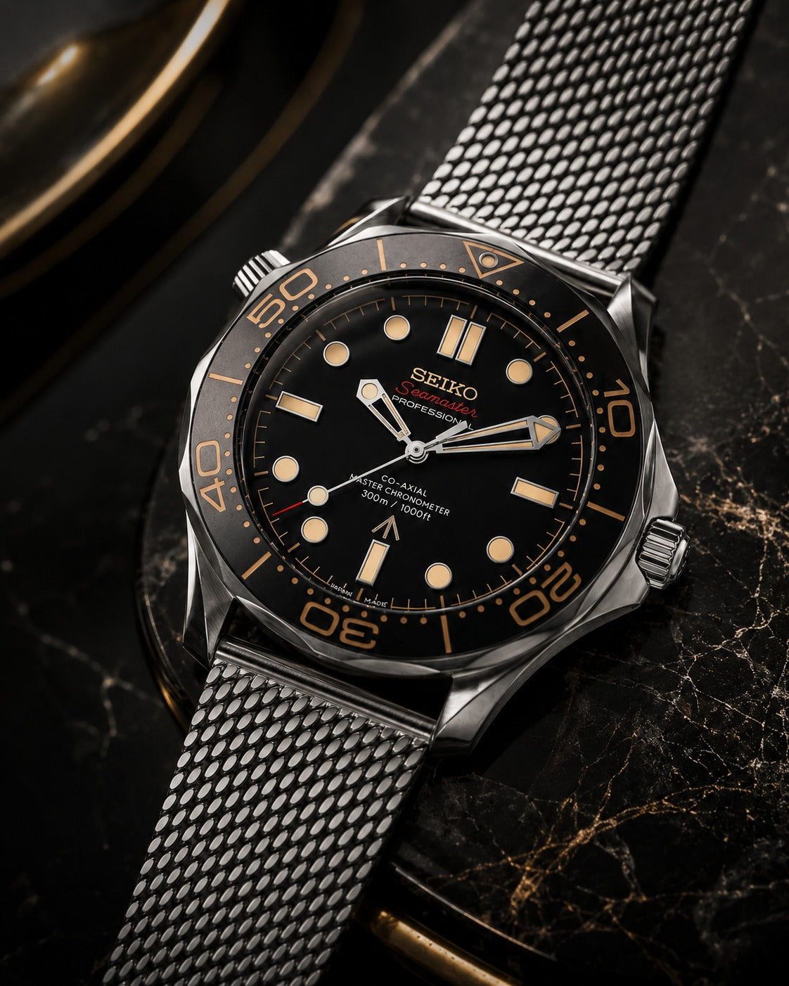 Seiko Amber Dusk custom diver with woven steel mesh bracelet, warm light on dark marble