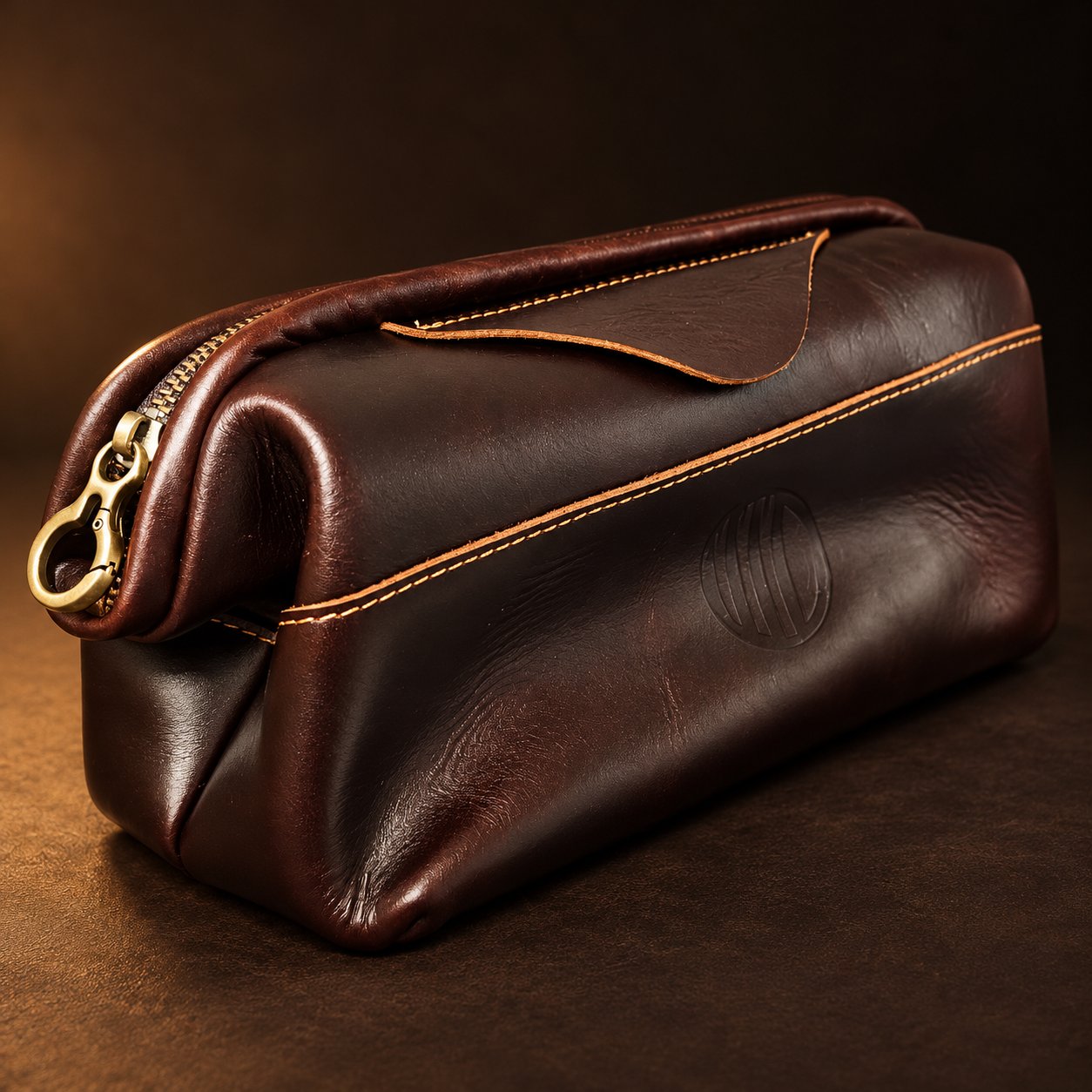 Three-quarter view of the Vintage Coffee Leather Pouch with the brass hook-style pull toward the camera